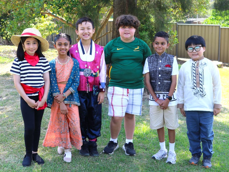 A group of children wearing their tradition and cultural dress