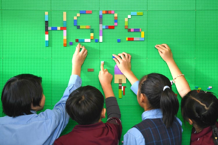 Children making HSPS with lego