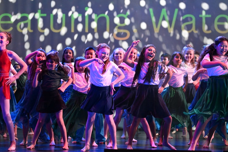 Children dancing on stage at Wakakirri